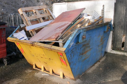 Cluttered garage before clearance in Brixton