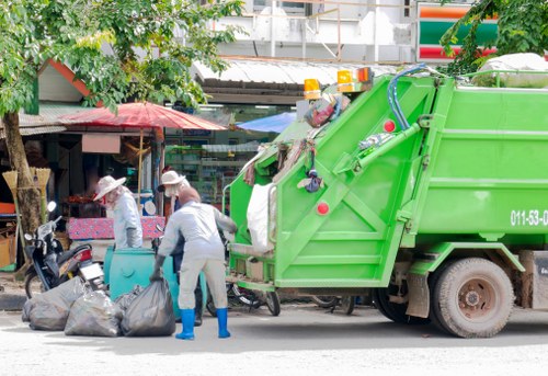 Satisfied business owners with clean workspace after waste removal